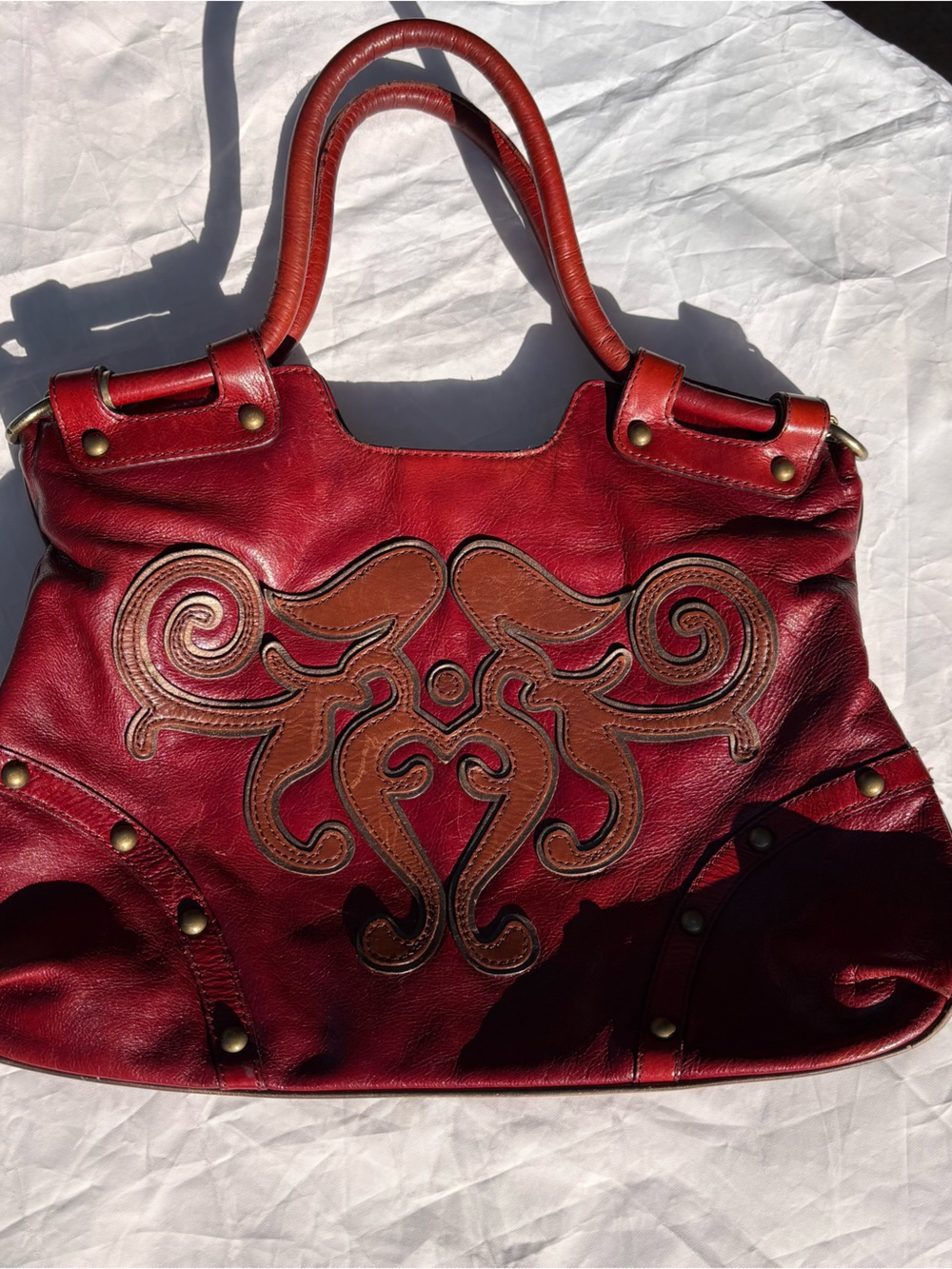 Red Leather Shoulder Bag with Brown Appliqué